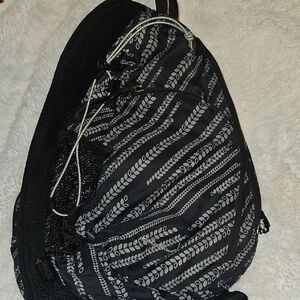 Eddie Bauer Black Sling Backpack with Leaf-Stripe Pattern